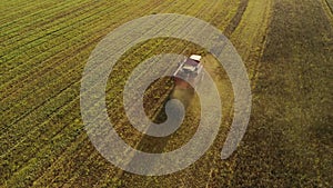 Vintage combine harvester cuts wheat in a field for the food industry and agribusiness agriculture