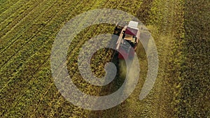 Vintage combine harvester cuts wheat in a field for the food industry and agribusiness agriculture