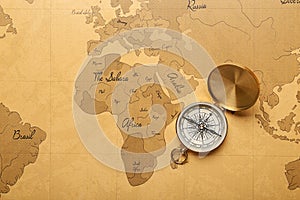 Vintage compass on world map