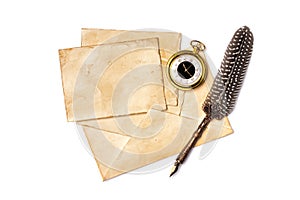 Vintage composition of yellowed cards with quill pen and pocket watch