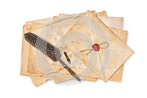 Vintage composition with yellowed paper sheets and quill pen