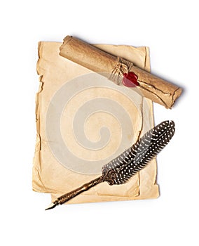 Vintage composition with yellowed paper sheets and quill pen