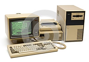 Vintage computer setup with beige monitor keyboard and tower