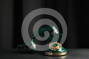 Vintage corded phone on black table