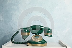 Vintage corded phone on white table