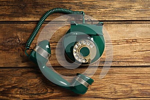 Vintage corded phone on wooden table