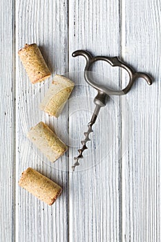 Vintage corkscrew and wine corks