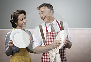 Vintage couple dish washing together