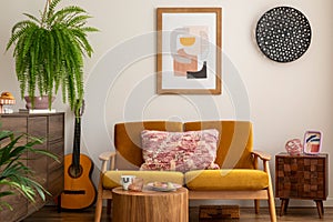 Vintage and cozy space of dining room with mock up poster frame, yellow sofa, wooden coffee table, guitar, plants, commode,