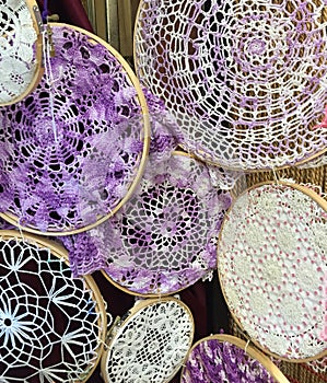 Vintage crocheted doilies in a group with stretch frames on them