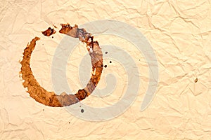 Vintage crumpled paper background with spot from spilled coffee