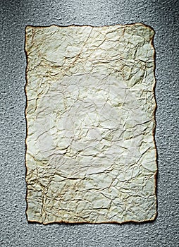 Vintage crumpled paper sheet on grey background