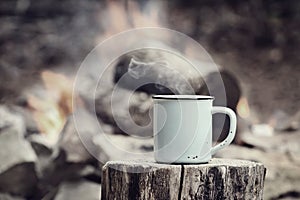 Vintage Cup of Coffee by a Campfire