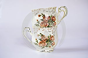 Vintage cup of tea with saucer isolated on white background ,Antique tea cup with rose pattern English style