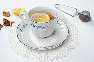 Vintage cups of tea and accessories on white background