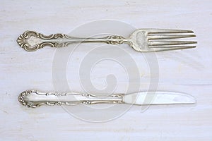 Vintage cutlery on rustic white board
