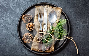 Vintage cutlery set, Christmas decoration on iron plate, slate background