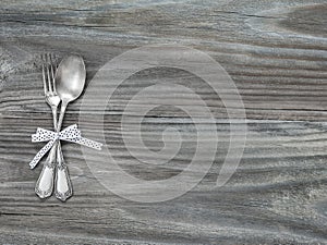 Vintage cutlery on a wooden boards