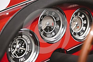 Vintage dashboard with various gauges on a retro car