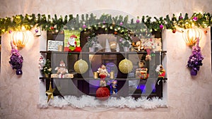 Vintage decorative shelf with Christmas decorations on the wall