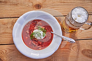 Vintage deep plate with traditional borsch soup.