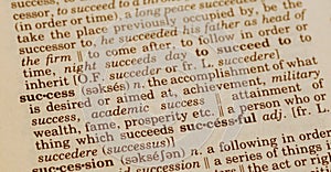 Vintage dictionary focus on `succes` photo