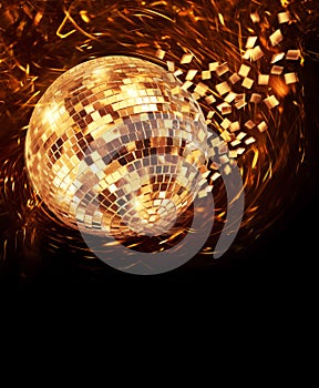 Golden disco mirror ball turning and breaking into fragments photo