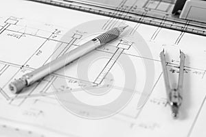 Vintage divider and mechanical pencil on technical drawing