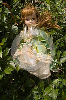 A vintage doll in the garden