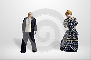 Vintage dolls, man in dark suit and woman in long dress