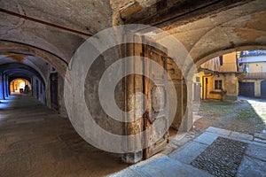 Vintage door and ancient passage in Saluzzo.