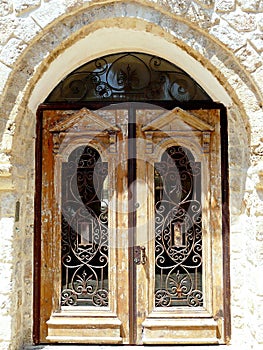 Vintage door with a beautiful wrought iron ornament