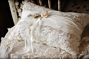 a vintage dress is upcycled into a beautiful pillow, adorned with ribbons and lace