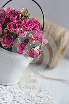 Vintage dried roses, napkin and tight twine