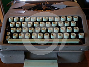 Vintage dusty typewriter with English and east-european letters