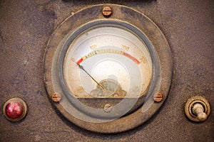 Vintage dusty volt meter in a metal casing