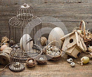 Vintage easter decoration with eggs and birdcage