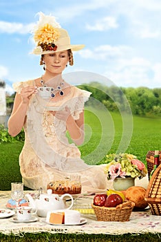 Vintage edwardian woman with hat at picnic