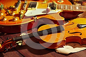 Vintage electric guitar, rare violin, dried flowers and rare notes closeup. Selective focus