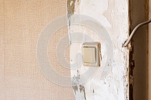 Vintage electrical switch panel on old concrete wall.