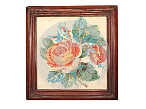 Vintage embroidery handmade wooden frame isolated on white background. photo