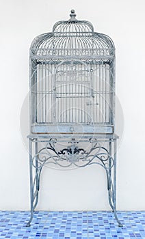 Vintage empty grey birdcage isolated