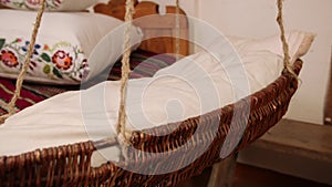 Vintage empty wooden cradle from the 19th century. A sense of antiquity.