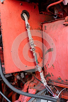 Vintage engine tractor system part old diesel engine heavy machine closeup grunge rusty oil dirty red abstract detail with sharp