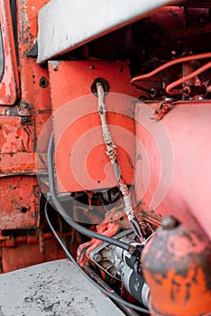 Vintage engine tractor system part old diesel engine heavy machine closeup grunge rusty oil dirty red abstract detail with sharp