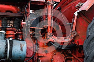 Vintage engine tractor system part old diesel engine heavy machine closeup grunge rusty oil dirty red abstract detail with sharp