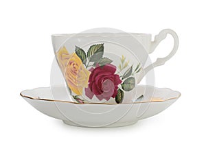 Vintage English porcelain tea cup and saucer with nice roses pattern isolated on white background