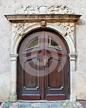 Vintage entrance door on a building facade in old Riga city