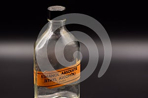 Vintage Ethanol Bottle on a Black Background