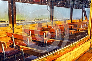 Vintage excursion boat for transportation of tourists across river canals in Giethoorn, Netherlands